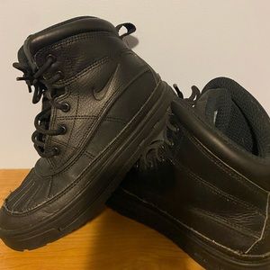 Black boys size 2.5 Nike boots .